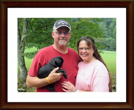 Sharon & Todd with Aegean/Pugsley on Adoption Day - Black Pug Puppies | My goal in life is to be as good of a person my dog already thinks I am.