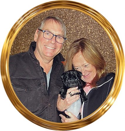 Stormy's Paige with her new mom and dad, Laura & John - Black Pug Puppies | A dog can't think that much about what he's doing, he just does what feels right.