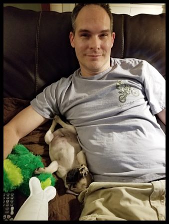 Sam aka Captain Biscuit sharing the couch with dad - Fawn Pug Puppies | A dog can't think that much about what he's doing, he just does what feels right.