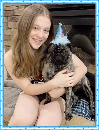Getting a Happy Birthday pug hug from my favorite girl! - Adult Brindle Pug | A dog can't think that much about what he's doing, he just does what feels right.